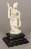 A 19th century Indian carved ivory figure of a female dancer Worked in traditional costume,