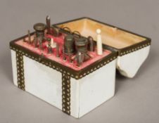 A white painted metal mounted casket form etui The hinged cover enclosing a fitted interior housing