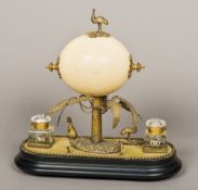 A 19th century desk stand Centred with an emu's egg beneath an emu finial,