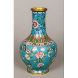 A 19th century Chinese gilt copper and cloisonne vase Decorated with lappets,