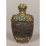 A Chinese cabochon turquoise mounted snuff bottle The main carved body probably coconut. 9.