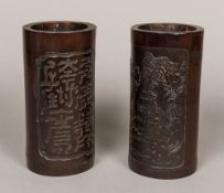 A pair of Chinese carved bamboo brush pots Each well worked with figures and pagodas in mountainous