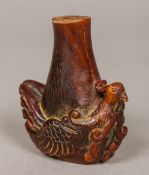 A 19th century Chinese carved horn snuff bottle The base carved with a bird. 6.5 cm high.