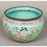 A cloisonne jardiniere Decorated in the round with birds amongst floral sprays,