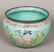 A cloisonne jardiniere Decorated in the round with birds amongst floral sprays,