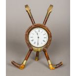 A Victorian novelty desk clock The white enamelled dial with black Roman numerals and indistinct