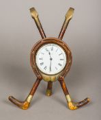 A Victorian novelty desk clock The white enamelled dial with black Roman numerals and indistinct