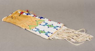 A Native American Indian hide pouch Typically decorated with beadwork, motifs and feathers.