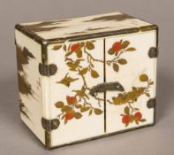 A 19th century Japanese gilt lacquered ivory miniature table cabinet Worked with signed mountainous