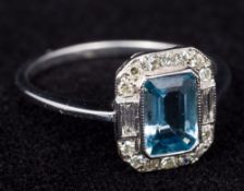An 18 ct white gold Art Deco diamond ring Centred with a blue stone, possibly an aquamarine. 1.