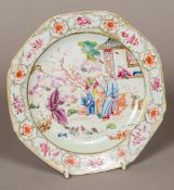 An 18th century Chinese famille rose porcelain dish Painted with a family and chickens in a garden.