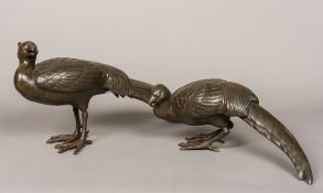 A pair of large Japanese patinated bronze models of pheasants Each naturalistically modelled,