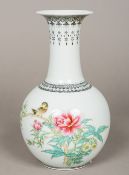 A Chinese Republic period porcelain vase Of flared bottle form decorated with a bird amongst floral