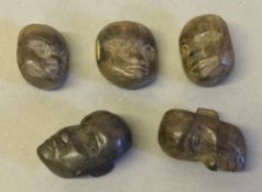 Five carved wood buttons, probably Benin All facially worked.