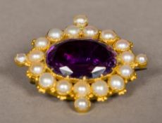 An amethyst and pearl set unmarked gold brooch With closed back, in plush lined fitted box. 3.