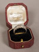 An Art Deco diamond set 18 ct white gold ring The stones baguette cut.