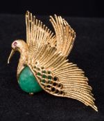 A jade and ruby set gold brooch Formed as a bird in flight. 3.5 cm wide.
