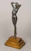 A patinated bronze model of a female nude Mounted on an oak stepped plinth base. 36 cm high.