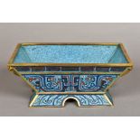 A Chinese cloisonne planter Typically worked, standing on a spreading foot,
