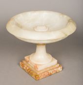 A 19th century alabaster tazza Of classical form, standing on a stepped marble plinth base. 26.