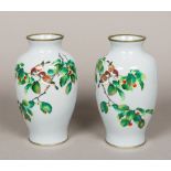 A pair of fine quality cloisonne vases Each decorated with two small birds on a fruiting branch