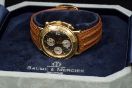 A Baume & Mercier 18 ct gold cased baumatic chronograph wristwatch The signed 1 1/8th inch black