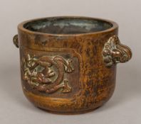 A Chinese bronze censor With twin mythical beast mask handles and opposing panels,