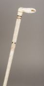 A 19th century whalebone walking stick Inlaid with tortoiseshell and ebony,