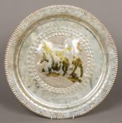 An Eastern white metal tray Worked with a figure riding a camel with gilt highlights within Arabic