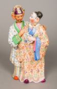 A 19th century porcelain chinoiserie figural group Formed as a male and female figure,
