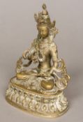 A Sino-Tibetan white metal Buddha Typically worked on a lotus cast plinth base. 15.5 cm high.