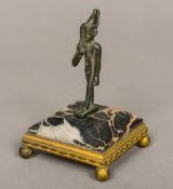 An Egyptian late period bronze figure of Harpocrates Mounted on a later canted square marble