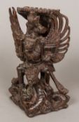 An Antique Far Eastern carved rosewood figural group Formed as a deity seated astride a mythical