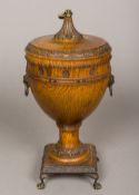 A Victorian turned oak twin handled urn and cover With carved decoration,