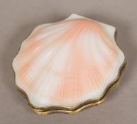A Russian silver gilt mounted compact Of small clam shell form. 7 cm wide.