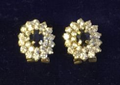 A pair of 18 ct gold white and blue sapphire set earrings 1.25 cm wide.