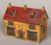 A painted tea caddy Modelled as a house, of typical form the interior with three vacant wells. 31.