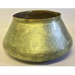 An Islamic brass bowl Extensively worked with arabesques and Islamic text,