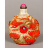 A large Chinese Peking glass snuff bottle Of centrally pierced circular form decorated with birds