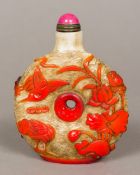 A large Chinese Peking glass snuff bottle Of centrally pierced circular form decorated with birds