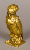 A 19th century gilt bronze inkwell Formed as a parakeet, the hinged head with glass inset eyes. 13.