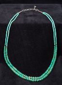 A Sterling silver mounted Navajo turquoise bead necklace Of double string form.