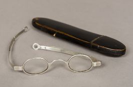 A pair of Georgian silver spectacles Of typical circular form, with elongating arms,