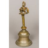 An antique Indian cast bronze hand bell With fertility figure finial. 27.5 cm high.