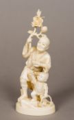 A 19th century Japanese carved ivory okimono Modelled as a father and son,