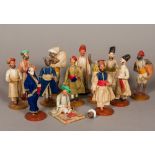 A collection of 19th century Indian plaster figures Each clothed and depicting a figure in various