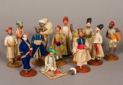 A collection of 19th century Indian plaster figures Each clothed and depicting a figure in various