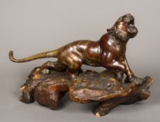 A large Japanese Meiji period patinated bronze animalier sculpture formed as a