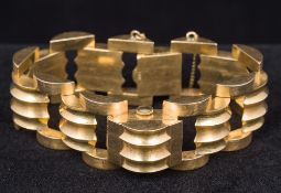 A 14 kt gold lady's wristwatch Of hinged bracelet form, the dial inscribed Norman 17 Jewels.