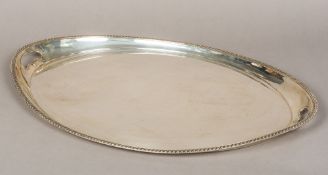A large George V silver serving tray, hallmarked London 1915,
